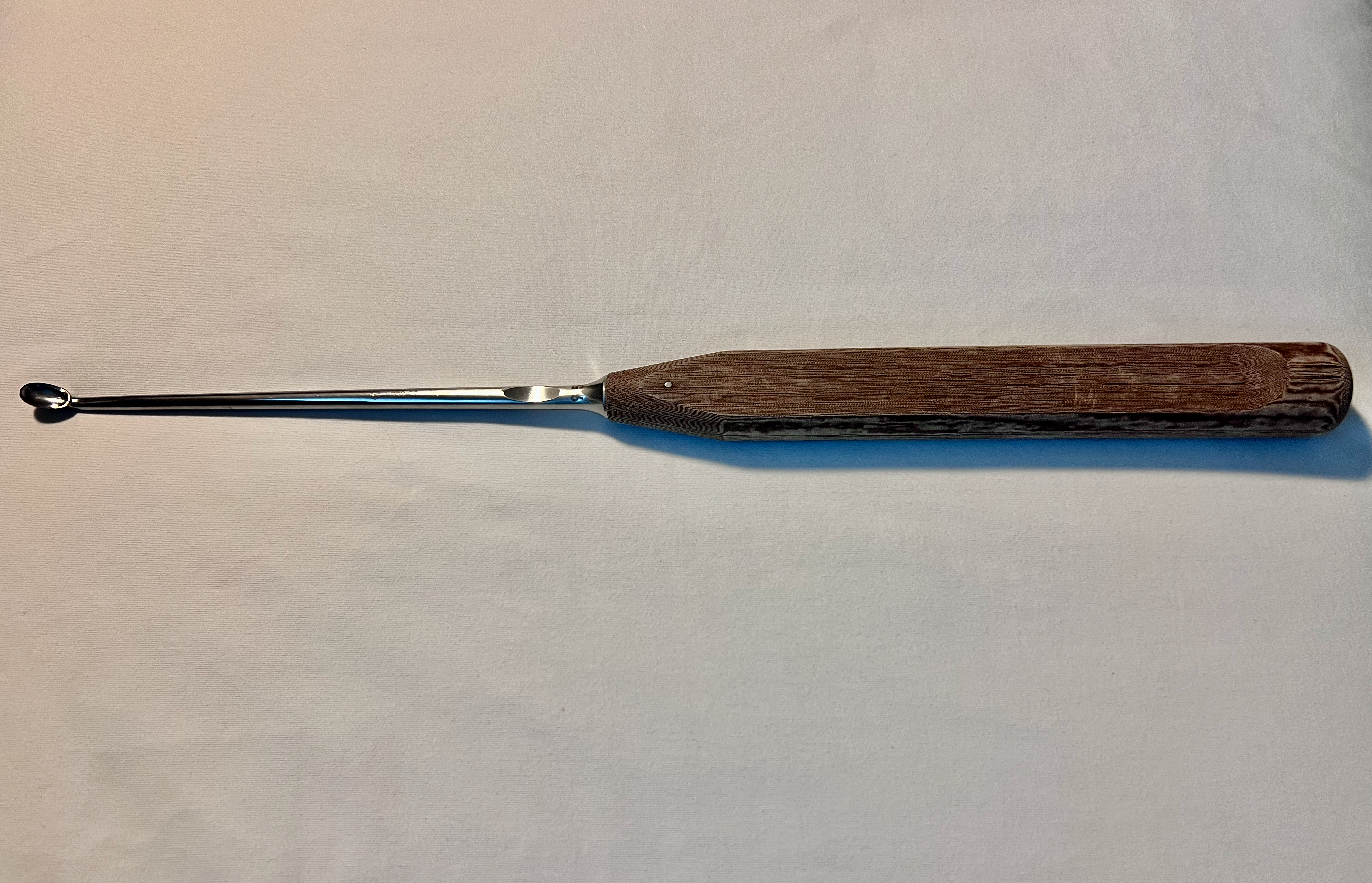 389.59 Angled Oval-Head Bone Curette 9.5mm US2005